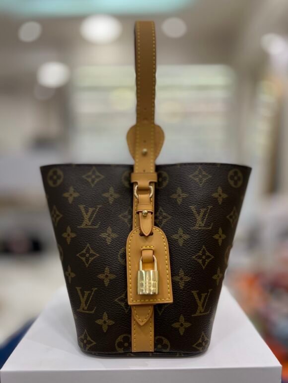 Louis Vuitton Slouchy PM Bag – Monogram Canvas (M11952)Material: Louis Vuitton Monogram coated canvas with natural cowhide leather trim  Color: Classic brown Monogram  Hardware: Gold-tone hardware with signature padlock name tag  Closure: Double top zipper for secure access  Interior: Textile lining with one internal zip pocket  Strap: Single flat shoulder handle (non-adjustable)  Made in: France, Spain, or Italy  📏 Size & Fit: Dimensions: 33 cm (L) × 22 cm (H) × 9 cm (W)  Strap drop: approx. 11–25 cm (fits comfortably on shoulder)  Lightweight and easy to carry – approx. 0.6 kg - Image 3