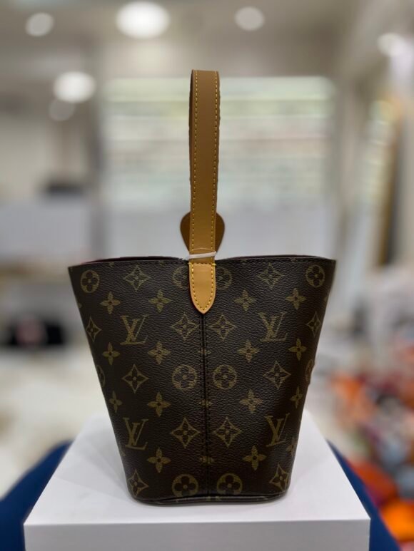 Louis Vuitton Slouchy PM Bag – Monogram Canvas (M11952)Material: Louis Vuitton Monogram coated canvas with natural cowhide leather trim  Color: Classic brown Monogram  Hardware: Gold-tone hardware with signature padlock name tag  Closure: Double top zipper for secure access  Interior: Textile lining with one internal zip pocket  Strap: Single flat shoulder handle (non-adjustable)  Made in: France, Spain, or Italy  📏 Size & Fit: Dimensions: 33 cm (L) × 22 cm (H) × 9 cm (W)  Strap drop: approx. 11–25 cm (fits comfortably on shoulder)  Lightweight and easy to carry – approx. 0.6 kg - Image 4